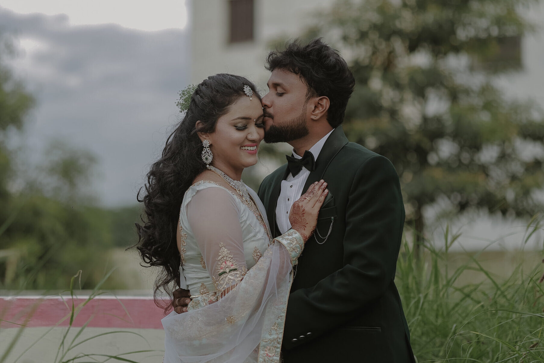 wedding photography in Erode Romantic couple portrait during wedding reception outdoor photoshoot